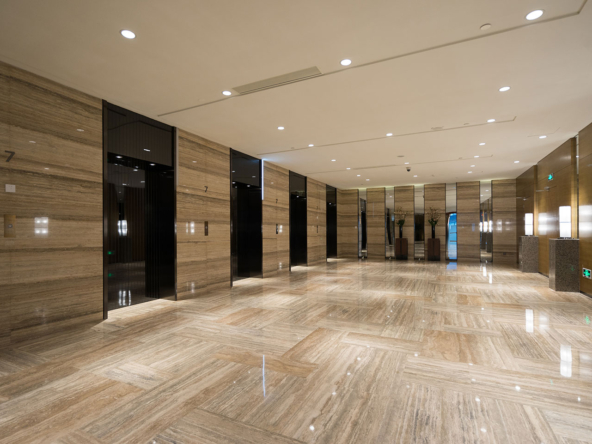 A marble floor in an elevator lobby | luxury flats