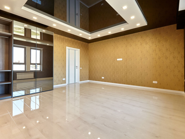 Room with wooden floors and a ceiling | residential plots in Gurgaon